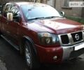 Красный Ниссан Титан, объемом двигателя 5.6 л и пробегом 120 тыс. км за 10000 $, фото 1 на Automoto.ua