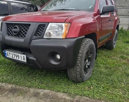 Червоний Ніссан Ікс-Терра, об'ємом двигуна 4 л та пробігом 160 тис. км за 18500 $, фото 1 на Automoto.ua