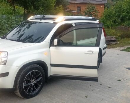 Білий Ніссан ІксТрейл, об'ємом двигуна 2 л та пробігом 221 тис. км за 13150 $, фото 12 на Automoto.ua