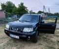 Черный Ниссан ИксТрейл, объемом двигателя 2 л и пробегом 280 тыс. км за 4500 $, фото 1 на Automoto.ua
