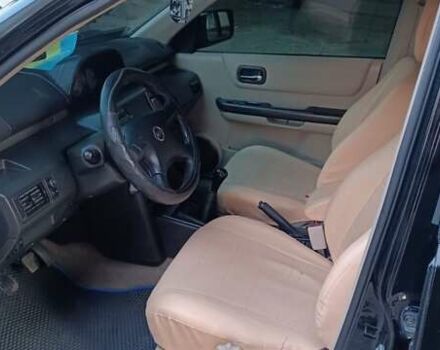 Черный Ниссан ИксТрейл, объемом двигателя 2 л и пробегом 300 тыс. км за 6300 $, фото 1 на Automoto.ua