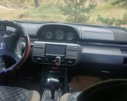 Черный Ниссан ИксТрейл, объемом двигателя 2 л и пробегом 302 тыс. км за 3984 $, фото 4 на Automoto.ua