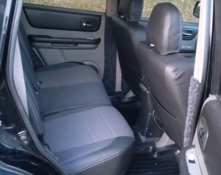 Черный Ниссан ИксТрейл, объемом двигателя 2 л и пробегом 380 тыс. км за 6500 $, фото 7 на Automoto.ua