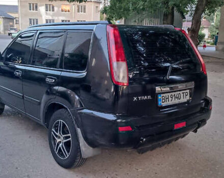 Черный Ниссан ИксТрейл, объемом двигателя 2 л и пробегом 300 тыс. км за 5500 $, фото 6 на Automoto.ua