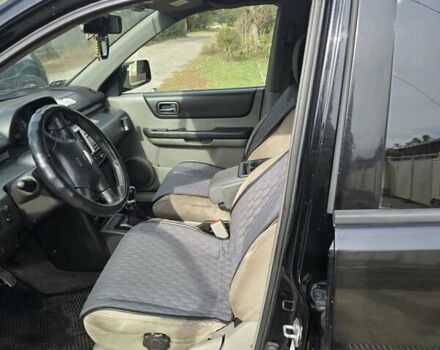 Черный Ниссан ИксТрейл, объемом двигателя 2.2 л и пробегом 300 тыс. км за 3300 $, фото 10 на Automoto.ua