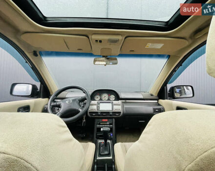 Черный Ниссан ИксТрейл, объемом двигателя 2 л и пробегом 320 тыс. км за 5600 $, фото 4 на Automoto.ua