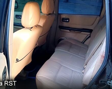 Черный Ниссан ИксТрейл, объемом двигателя 2 л и пробегом 257 тыс. км за 5800 $, фото 10 на Automoto.ua