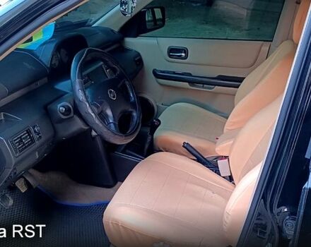 Черный Ниссан ИксТрейл, объемом двигателя 2 л и пробегом 257 тыс. км за 5800 $, фото 9 на Automoto.ua