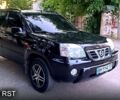 Черный Ниссан ИксТрейл, объемом двигателя 2 л и пробегом 250 тыс. км за 6300 $, фото 1 на Automoto.ua
