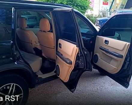Черный Ниссан ИксТрейл, объемом двигателя 2 л и пробегом 257 тыс. км за 5800 $, фото 11 на Automoto.ua