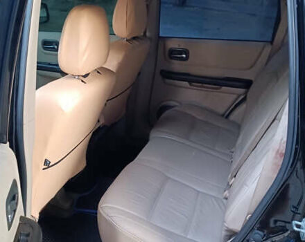 Черный Ниссан ИксТрейл, объемом двигателя 2 л и пробегом 300 тыс. км за 5500 $, фото 9 на Automoto.ua