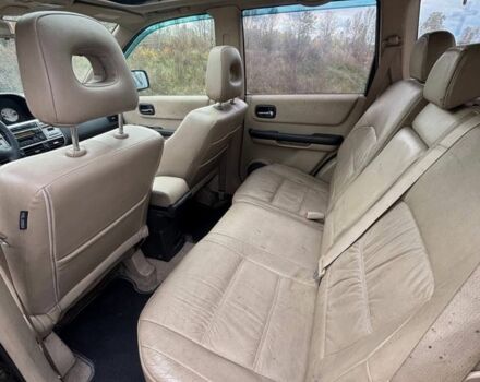 Черный Ниссан ИксТрейл, объемом двигателя 2.2 л и пробегом 300 тыс. км за 4000 $, фото 7 на Automoto.ua