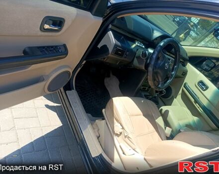 Черный Ниссан ИксТрейл, объемом двигателя 2.2 л и пробегом 333 тыс. км за 6500 $, фото 8 на Automoto.ua