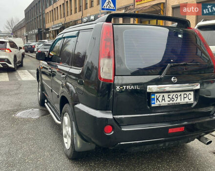 Черный Ниссан ИксТрейл, объемом двигателя 2 л и пробегом 320 тыс. км за 5600 $, фото 2 на Automoto.ua