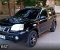 Черный Ниссан ИксТрейл, объемом двигателя 2 л и пробегом 257 тыс. км за 5800 $, фото 1 на Automoto.ua