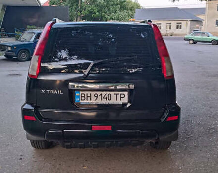Черный Ниссан ИксТрейл, объемом двигателя 2 л и пробегом 300 тыс. км за 5500 $, фото 4 на Automoto.ua