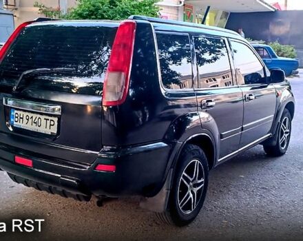 Черный Ниссан ИксТрейл, объемом двигателя 2 л и пробегом 257 тыс. км за 5800 $, фото 5 на Automoto.ua