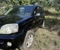 Черный Ниссан ИксТрейл, объемом двигателя 2.2 л и пробегом 400 тыс. км за 4000 $, фото 1 на Automoto.ua