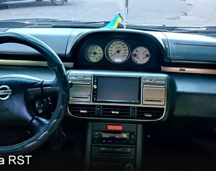 Черный Ниссан ИксТрейл, объемом двигателя 2 л и пробегом 257 тыс. км за 5800 $, фото 12 на Automoto.ua