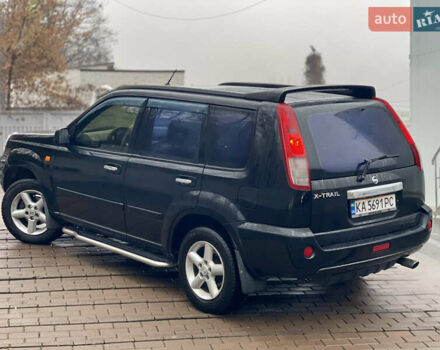 Черный Ниссан ИксТрейл, объемом двигателя 2 л и пробегом 320 тыс. км за 5600 $, фото 18 на Automoto.ua