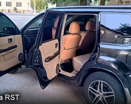 Черный Ниссан ИксТрейл, объемом двигателя 2 л и пробегом 257 тыс. км за 5800 $, фото 8 на Automoto.ua