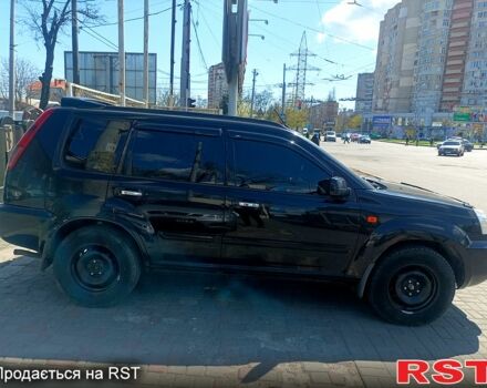 Черный Ниссан ИксТрейл, объемом двигателя 2.2 л и пробегом 333 тыс. км за 6500 $, фото 4 на Automoto.ua