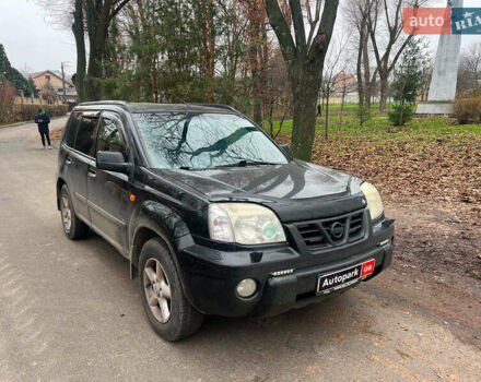 Черный Ниссан ИксТрейл, объемом двигателя 2 л и пробегом 215 тыс. км за 6490 $, фото 2 на Automoto.ua