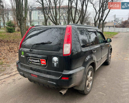 Черный Ниссан ИксТрейл, объемом двигателя 2 л и пробегом 215 тыс. км за 6490 $, фото 4 на Automoto.ua