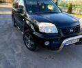 Черный Ниссан ИксТрейл, объемом двигателя 2.5 л и пробегом 300 тыс. км за 4200 $, фото 1 на Automoto.ua