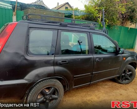 Черный Ниссан ИксТрейл, объемом двигателя 2.2 л и пробегом 357 тыс. км за 4000 $, фото 4 на Automoto.ua