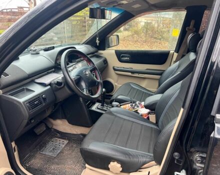 Черный Ниссан ИксТрейл, объемом двигателя 2 л и пробегом 215 тыс. км за 6490 $, фото 9 на Automoto.ua