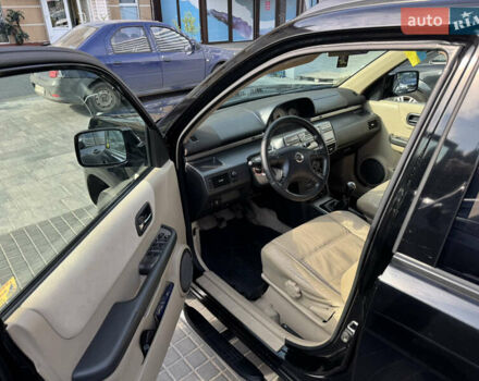 Черный Ниссан ИксТрейл, объемом двигателя 2.5 л и пробегом 318 тыс. км за 8000 $, фото 7 на Automoto.ua