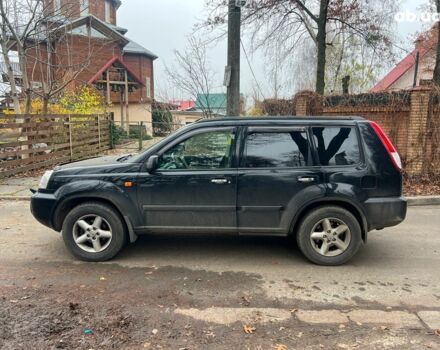 Чорний Ніссан ІксТрейл, об'ємом двигуна 2 л та пробігом 215 тис. км за 6490 $, фото 7 на Automoto.ua