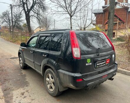 Чорний Ніссан ІксТрейл, об'ємом двигуна 2 л та пробігом 215 тис. км за 6490 $, фото 6 на Automoto.ua