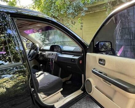 Черный Ниссан ИксТрейл, объемом двигателя 2.5 л и пробегом 287 тыс. км за 7700 $, фото 6 на Automoto.ua