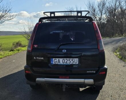 Черный Ниссан ИксТрейл, объемом двигателя 2 л и пробегом 365 тыс. км за 4023 $, фото 2 на Automoto.ua