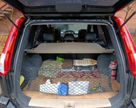 Чорний Ніссан ІксТрейл, об'ємом двигуна 2 л та пробігом 213 тис. км за 7538 $, фото 4 на Automoto.ua