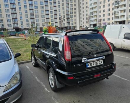 Черный Ниссан ИксТрейл, объемом двигателя 2 л и пробегом 290 тыс. км за 7000 $, фото 3 на Automoto.ua
