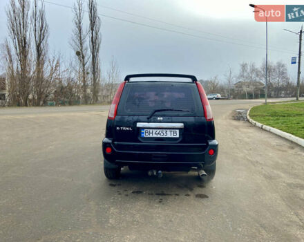 Черный Ниссан ИксТрейл, объемом двигателя 2.49 л и пробегом 300 тыс. км за 6200 $, фото 3 на Automoto.ua
