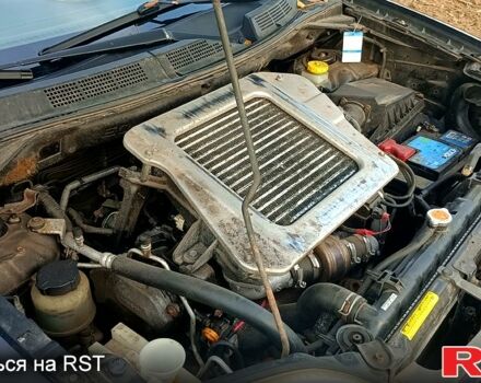 Черный Ниссан ИксТрейл, объемом двигателя 2.2 л и пробегом 294 тыс. км за 5000 $, фото 4 на Automoto.ua