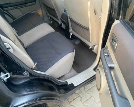 Черный Ниссан ИксТрейл, объемом двигателя 2.2 л и пробегом 251 тыс. км за 3800 $, фото 14 на Automoto.ua