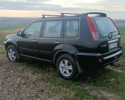 Черный Ниссан ИксТрейл, объемом двигателя 2.2 л и пробегом 294 тыс. км за 5000 $, фото 3 на Automoto.ua