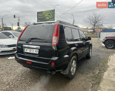 Черный Ниссан ИксТрейл, объемом двигателя 2 л и пробегом 173 тыс. км за 4700 $, фото 4 на Automoto.ua