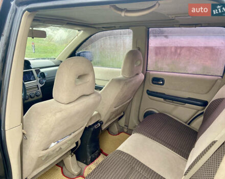 Черный Ниссан ИксТрейл, объемом двигателя 2.49 л и пробегом 300 тыс. км за 6200 $, фото 9 на Automoto.ua