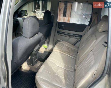 Черный Ниссан ИксТрейл, объемом двигателя 2.18 л и пробегом 394 тыс. км за 6500 $, фото 5 на Automoto.ua