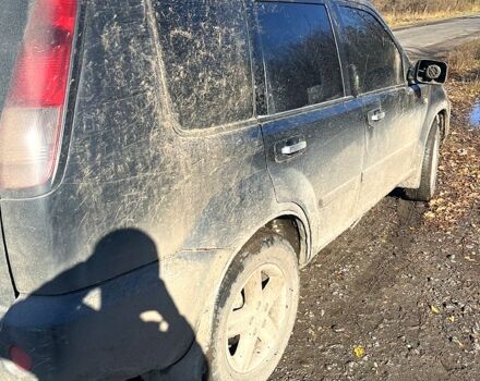 Черный Ниссан ИксТрейл, объемом двигателя 2.5 л и пробегом 365 тыс. км за 4500 $, фото 3 на Automoto.ua