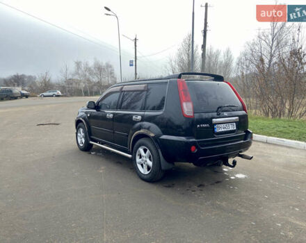 Черный Ниссан ИксТрейл, объемом двигателя 2.49 л и пробегом 300 тыс. км за 6200 $, фото 2 на Automoto.ua