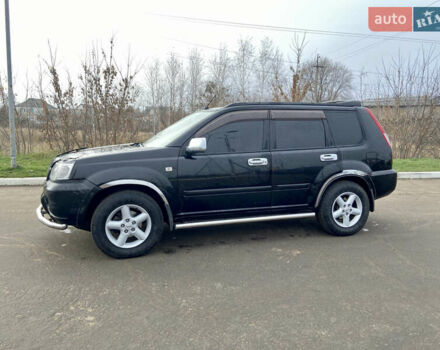 Черный Ниссан ИксТрейл, объемом двигателя 2.49 л и пробегом 300 тыс. км за 6200 $, фото 1 на Automoto.ua