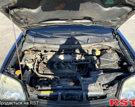 Черный Ниссан ИксТрейл, объемом двигателя 2.5 л и пробегом 245 тыс. км за 6500 $, фото 7 на Automoto.ua