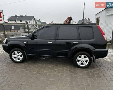 Черный Ниссан ИксТрейл, объемом двигателя 2.5 л и пробегом 282 тыс. км за 6250 $, фото 2 на Automoto.ua